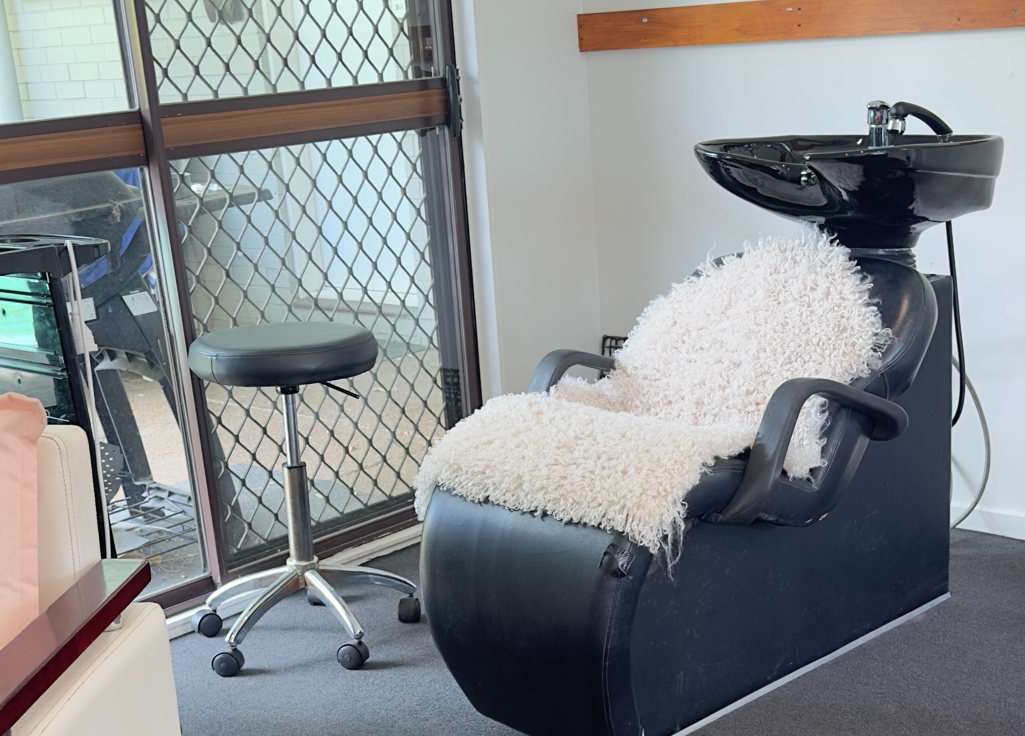 Comfortable hair wash station at Dreamy Looks By Kara, Ashmore, Queensland, AU, featuring plush seating.