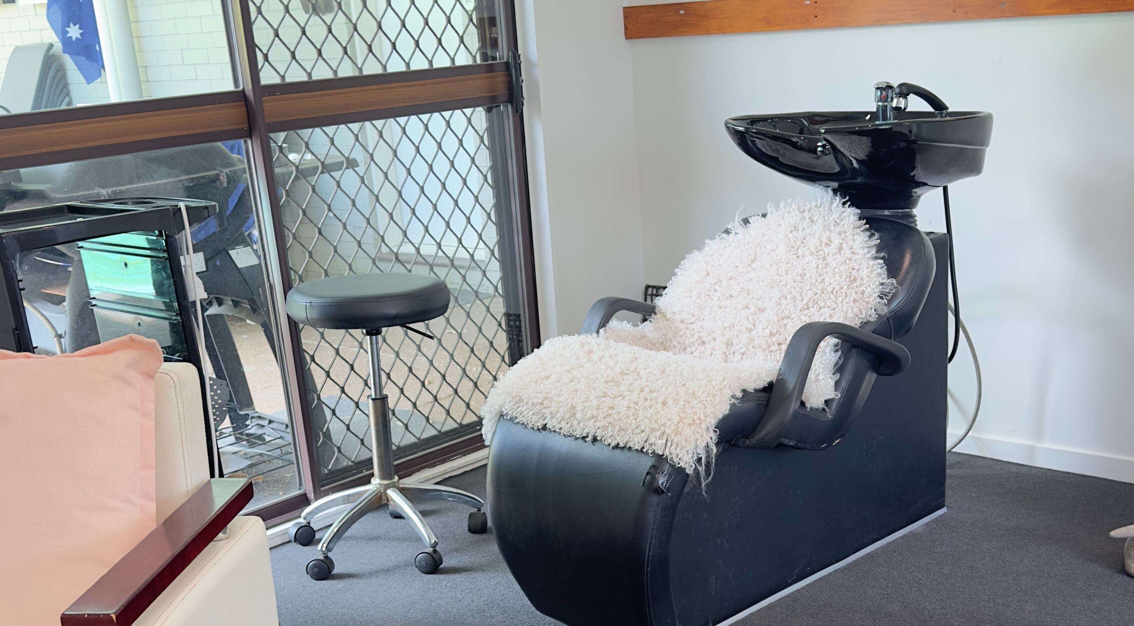 Comfortable hair wash station at Dreamy Looks By Kara, Ashmore, Queensland, AU, featuring plush seating.