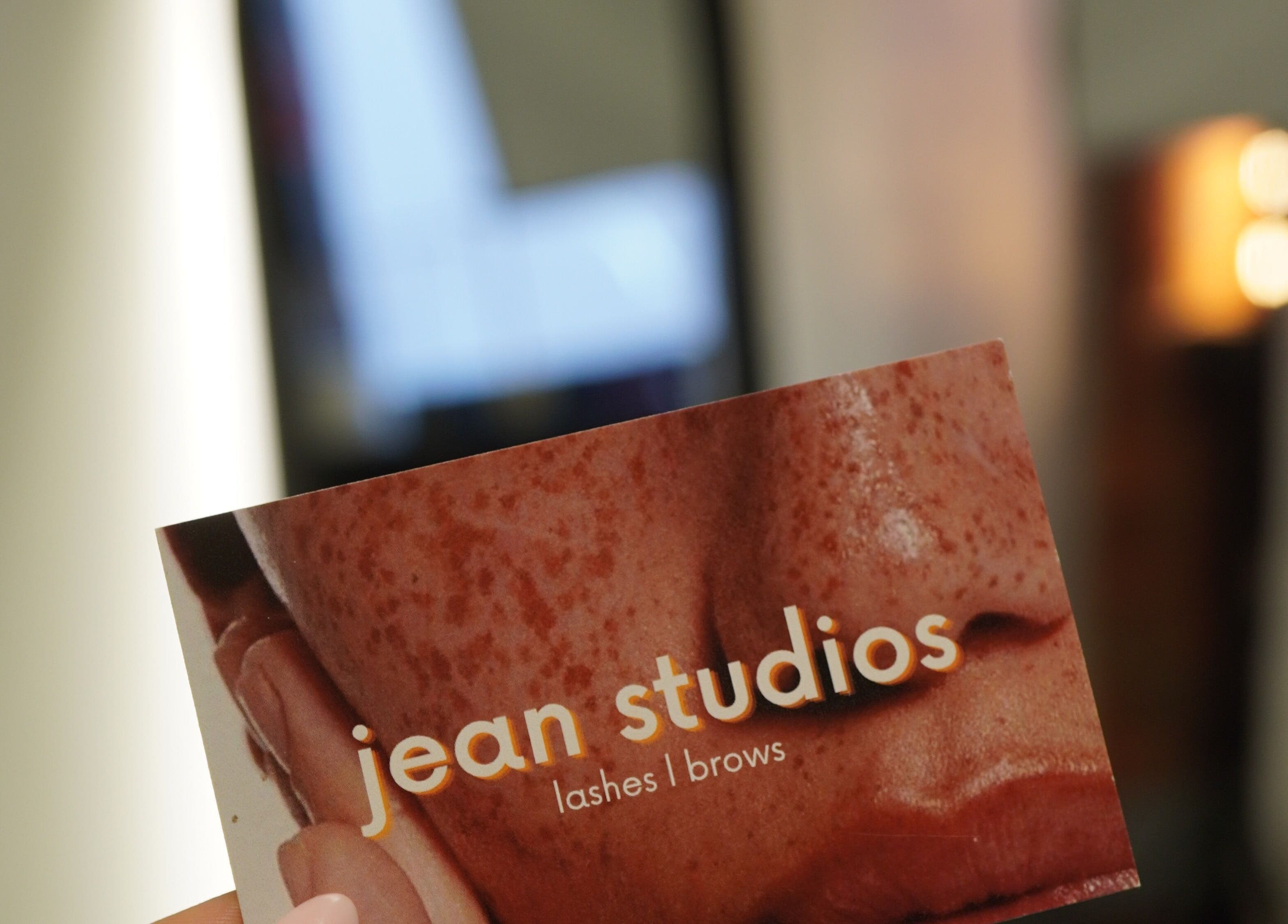 Close-up of Jean Studios promotional card at Manchester Lashes | Jean Studios | Ancoats Beehive Mill, Manchester, England, GB.