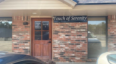 Entrance to Touch of Serenity Wellness Spa, Moore, Oklahoma, US, featuring a stylish brick facade.