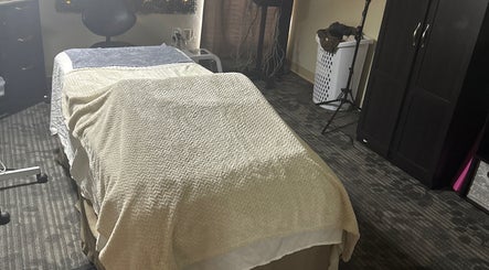 Cozy massage room at Touch of Serenity Wellness Spa, Moore, Oklahoma, US, featuring a comfortable treatment bed.