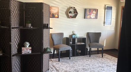 Cozy seating area at Touch of Serenity Wellness Spa in Moore, Oklahoma, US, featuring elegant decor and calming ambiance.