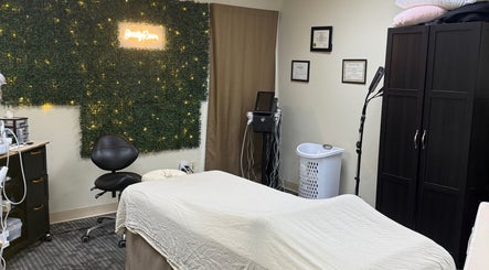 Cozy spa room at Touch of Serenity Wellness Spa, Moore, Oklahoma, US, featuring treatment beds and decor.