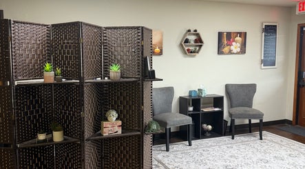 Cozy waiting area at Touch of Serenity Wellness Spa in Moore, Oklahoma with elegant decor and seating.