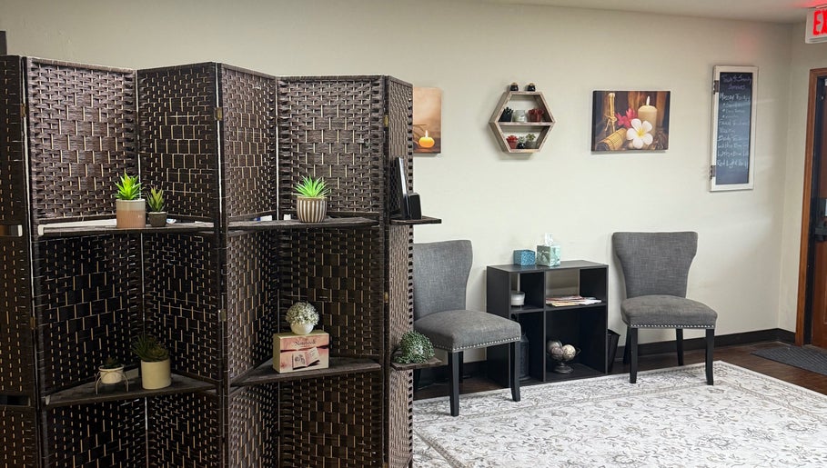 Relaxing lounge area at Touch of Serenity Wellness Spa, Moore, Oklahoma, US with elegant decor and cozy seating.