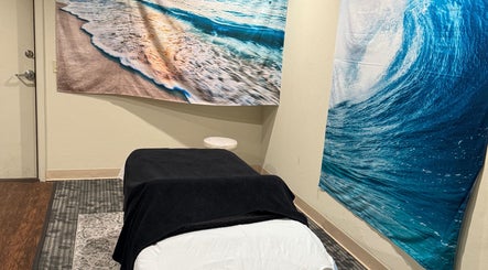 Tranquil massage room at Touch of Serenity Wellness Spa, Moore, Oklahoma, US with ocean-themed decor.