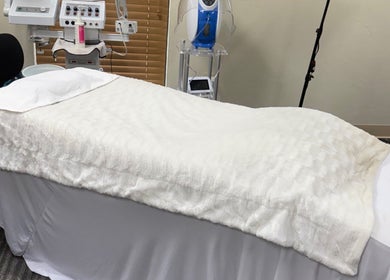 Massage table at Touch of Serenity Wellness Spa in Moore, Oklahoma, US, ready for a relaxing session.