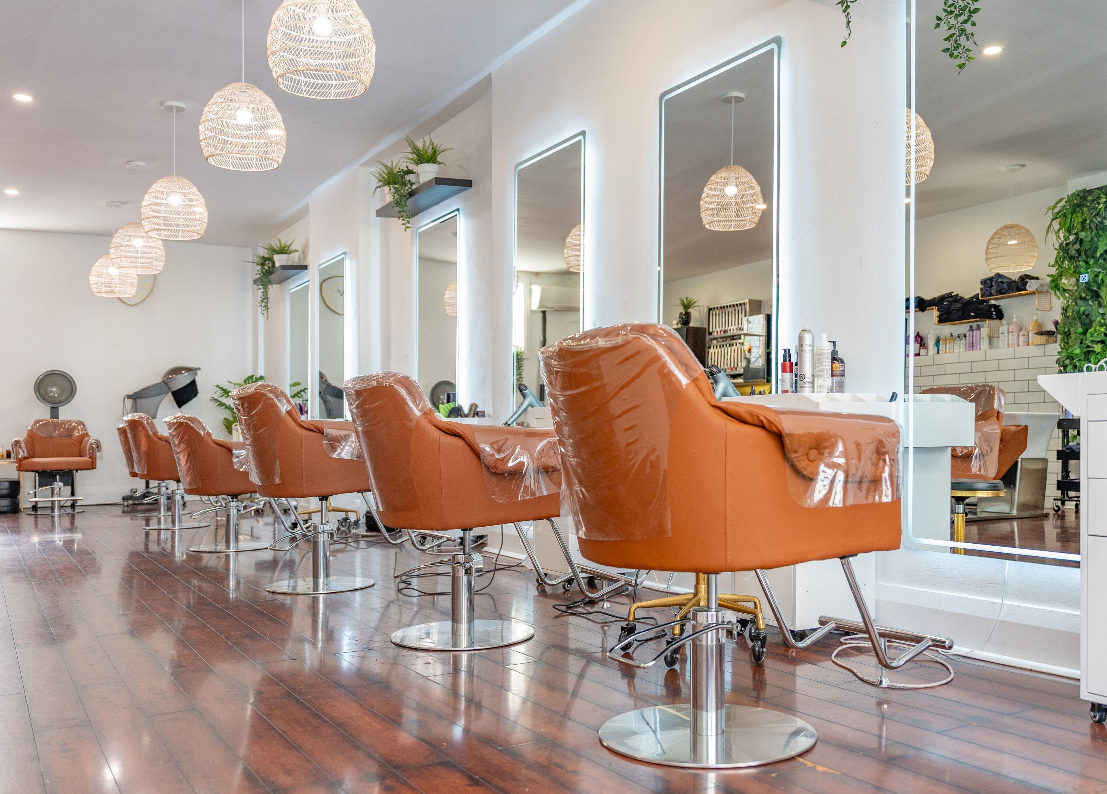 Modern salon interior with plush chairs at The Curl Lounge, Toronto, Ontario, CA, showcasing sleek design aesthetics.