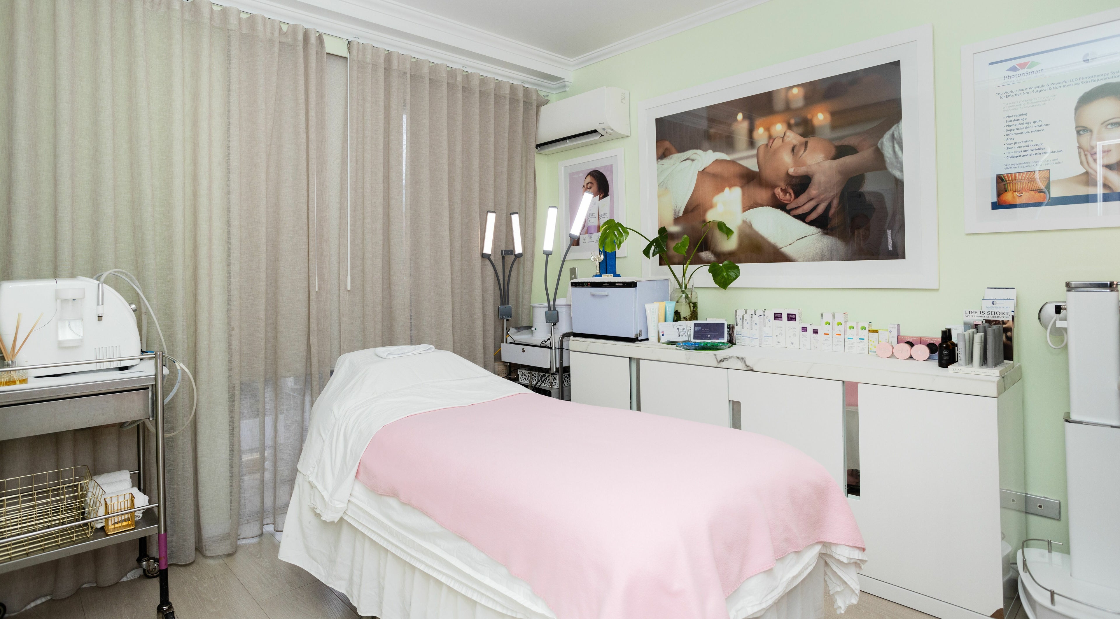 Treatment room at Forever Beauty Day Spa, Wolli Creek, New South Wales, AU, with bed and skincare products.