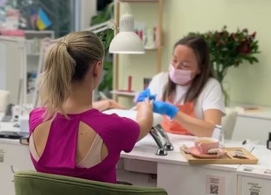 Client receives manicure at The Beauty Clarendon Nails and Body Services in Arlington, Virginia, US.