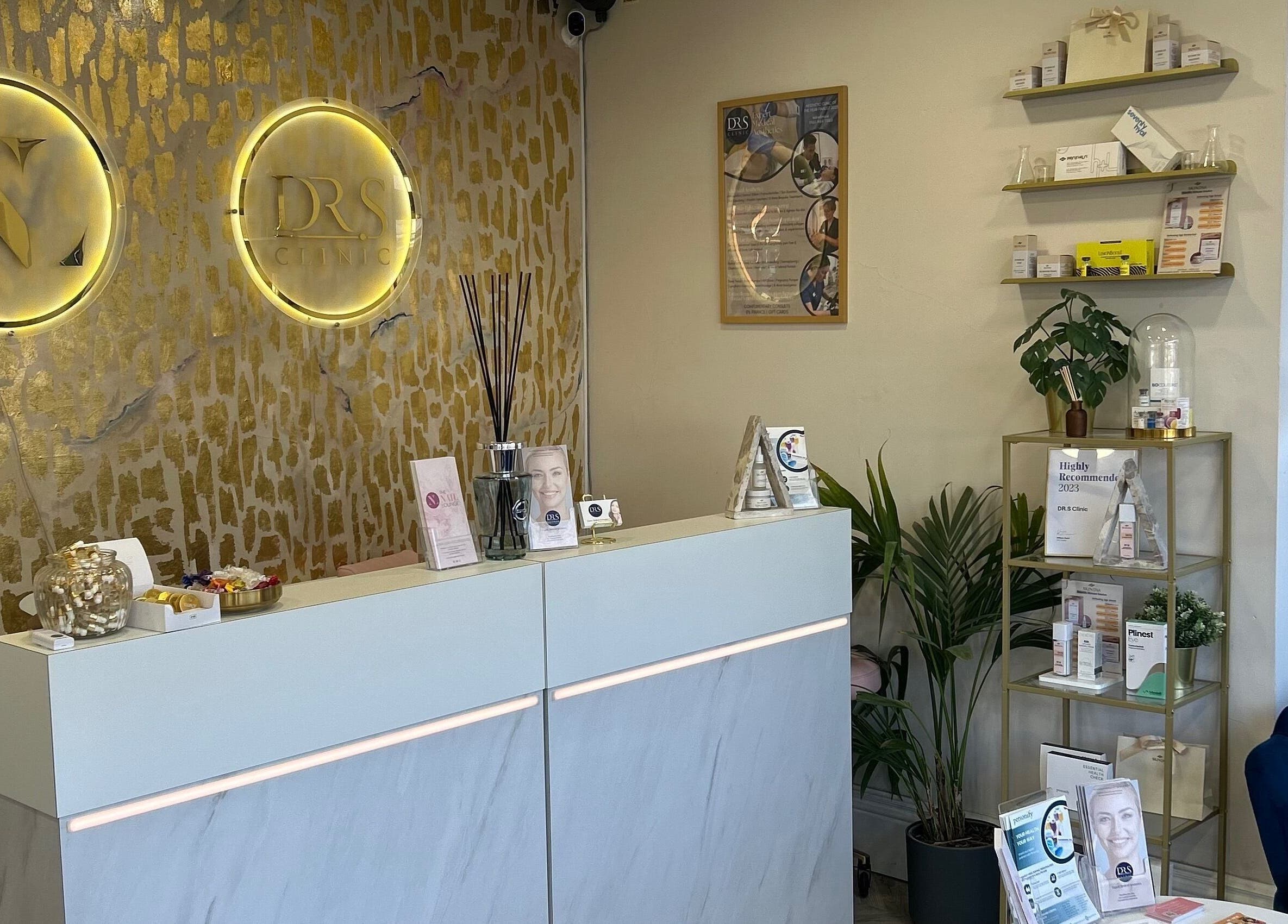 Sleek reception area at DR.S Clinic, Prestwich, England, GB with modern decor and professional displays.