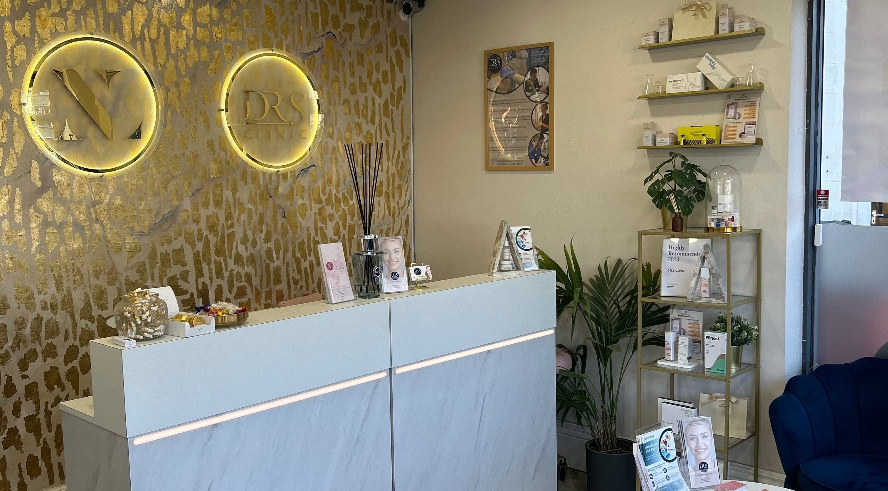 Sleek reception area at DR.S Clinic, Prestwich, England, GB with modern decor and professional displays.