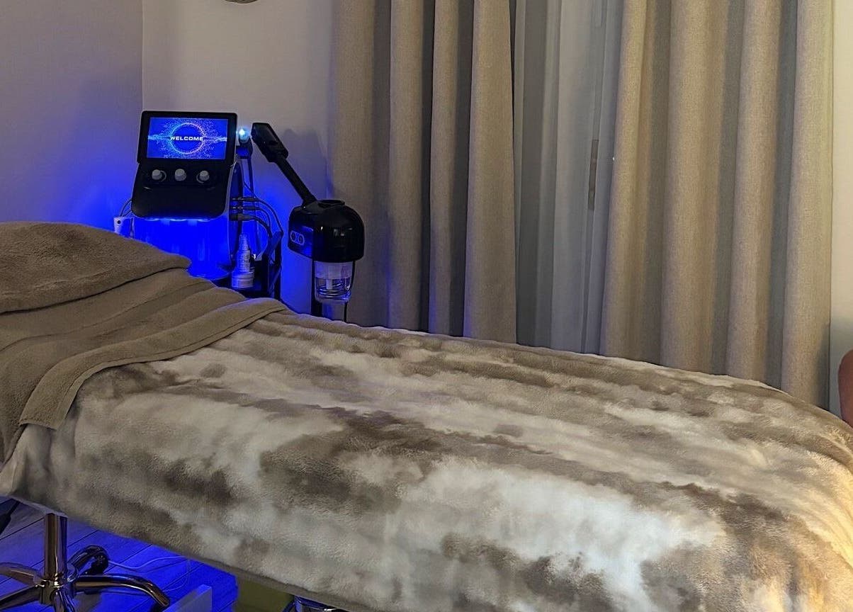 Relaxing treatment room at DR.S Clinic in Prestwich, England, GB, featuring a comfortable massage bed.