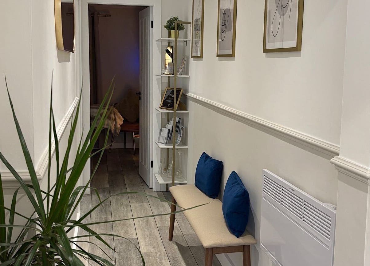 Inviting hallway at DR.S Clinic in Prestwich, England, GB, featuring elegant decor and comfortable seating.