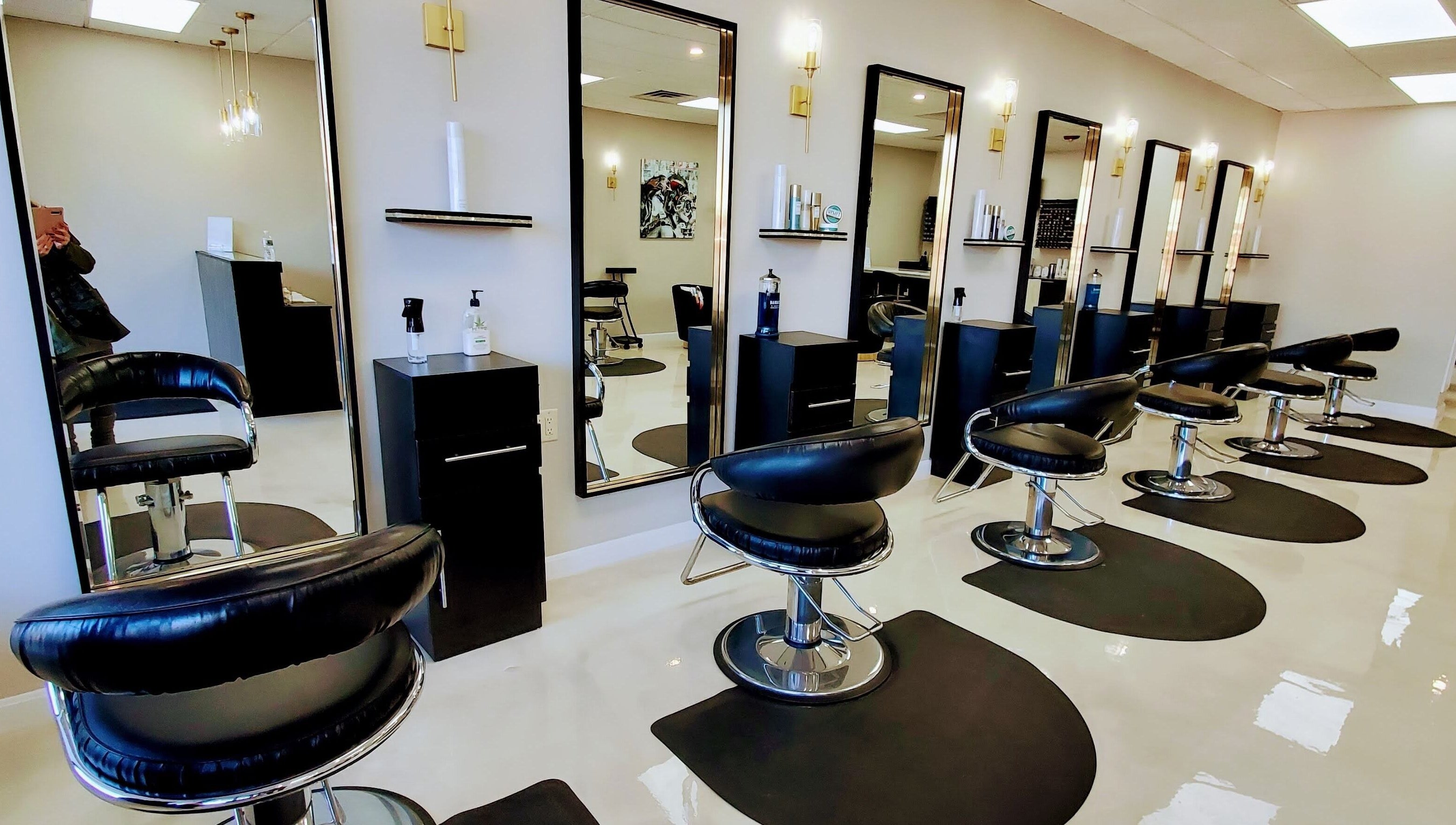 Stylish salon interior with modern chairs at Salon Secora, Saugus, Massachusetts, US.