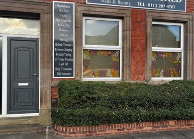 Entrance of Totally Polished Beauty & Nails with services listed, located in Drighlington, England, GB.