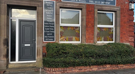 Exterior of Totally Polished Beauty & Nails, Drighlington, England, showcasing its stylish door and window signage.
