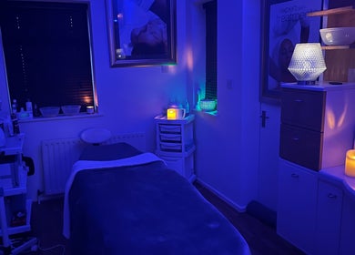 Relaxing treatment room at Totally Polished Beauty & Nails, Drighlington, England, illuminated by calming blue light.