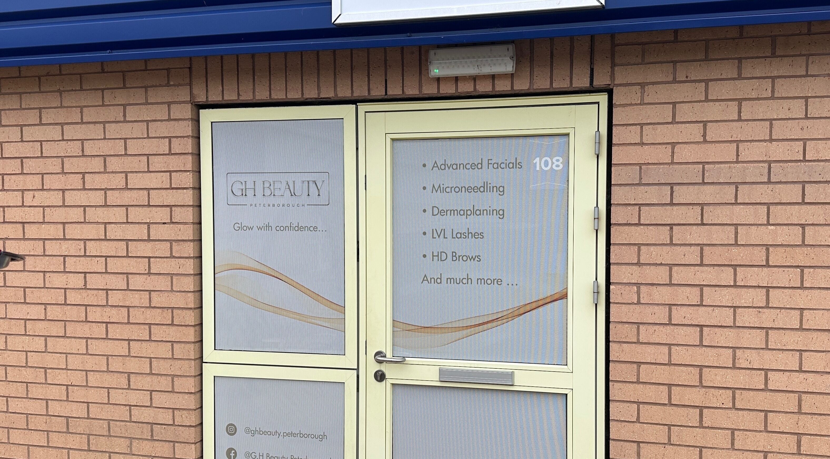 Entrance of GH Beauty in Peterborough, England, GB showcasing services like facials and microneedling.
