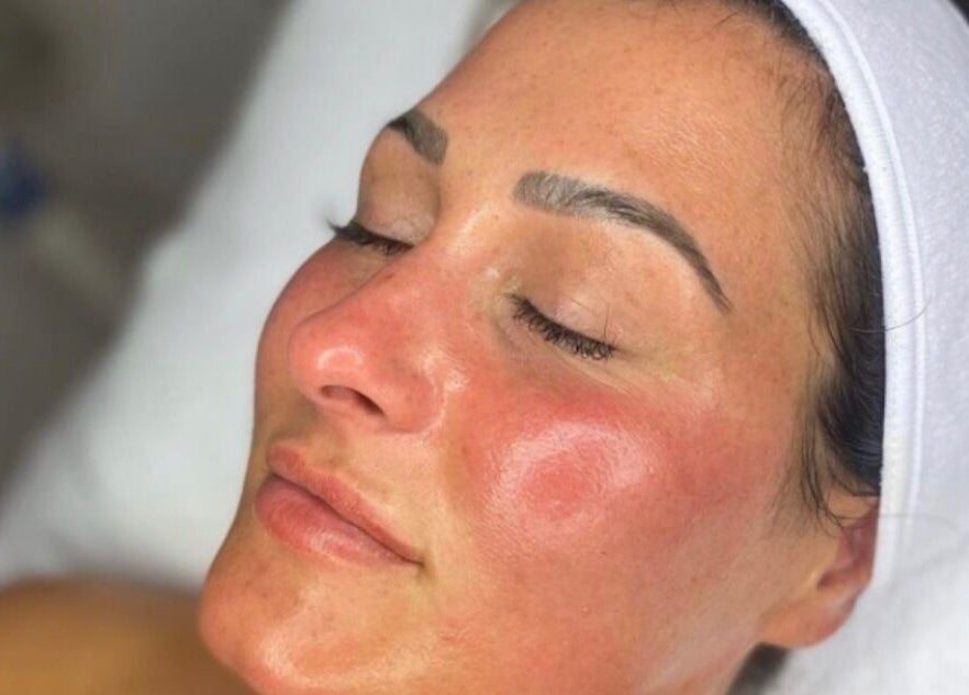 Woman enjoying facial treatment at GH Beauty, Peterborough, England, GB. Close-up of rejuvenated skin.