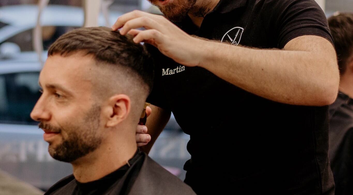 Professional barber styling hair at Gents of Budapest (VI.ker), Budapest, Magyar, HU.