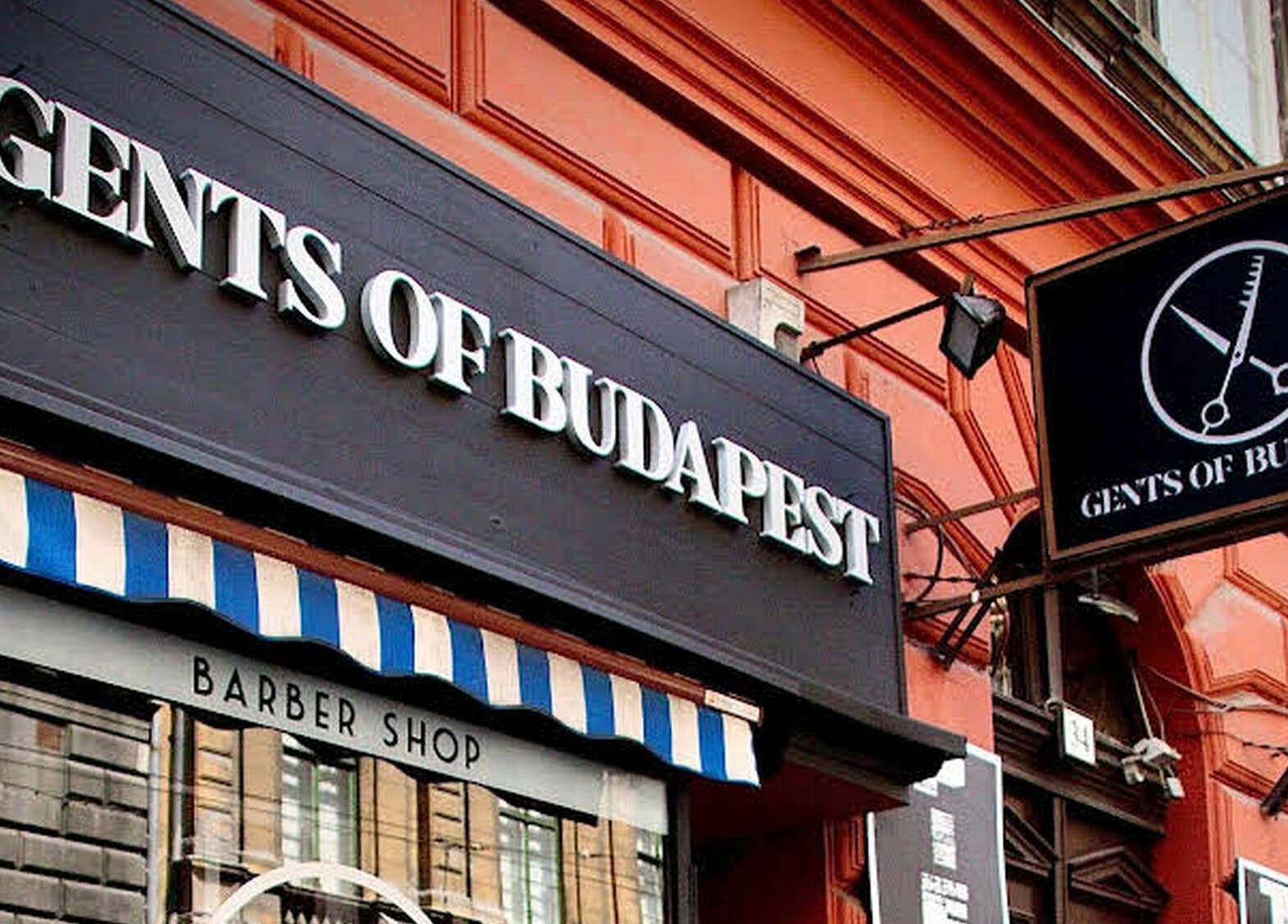 Front of Gents of Budapest (VI.ker) barber shop, located at Budapest, Magyar, HU, showcasing its inviting signage.