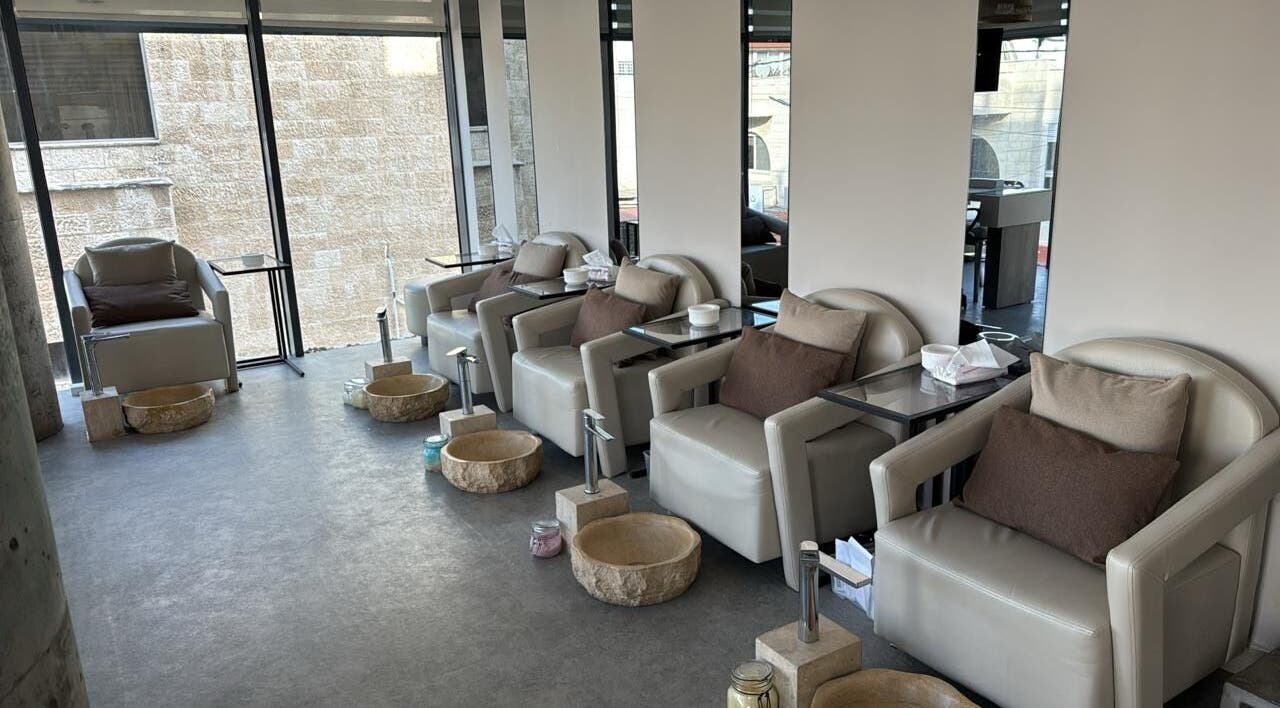 Comfortable lounge seating at The Concept Beauty Lounge in Amman, Amman Governorate, JO, ideal for relaxation.