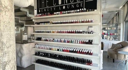 Nail polish display at The Concept Beauty Lounge, Amman, Amman Governorate, JO, showcasing vibrant choices.