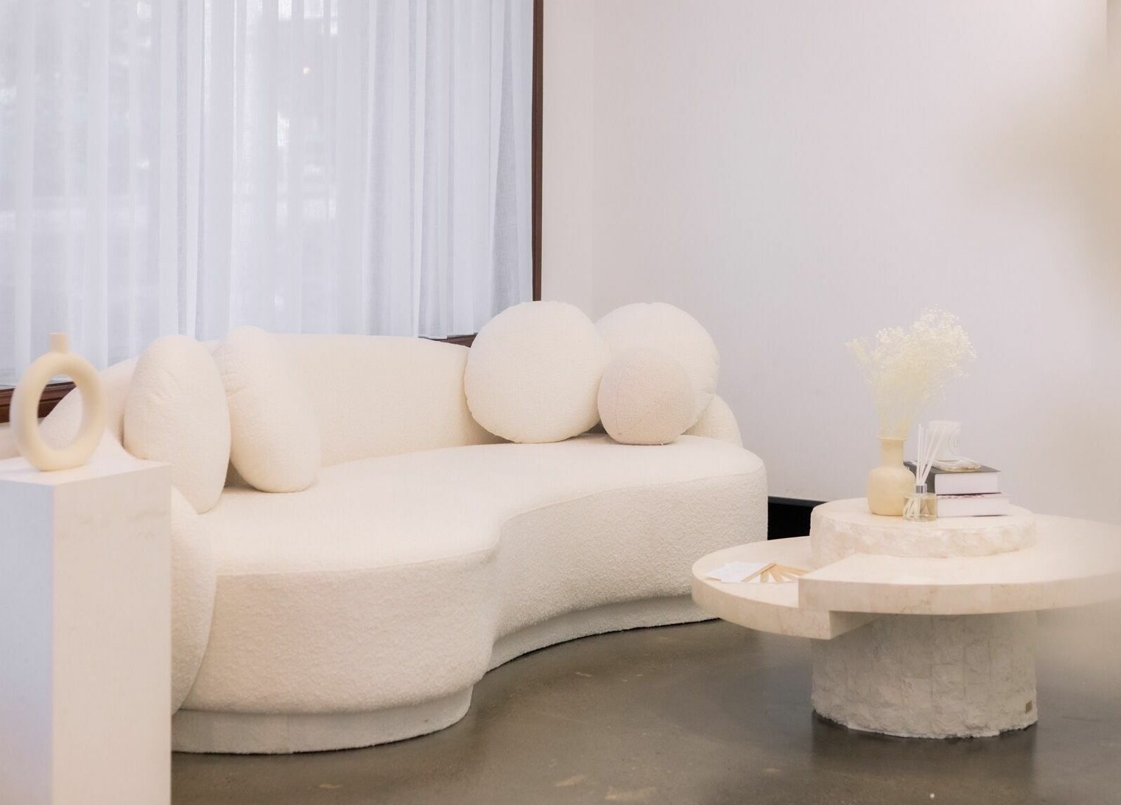 Elegant lounge area with a plush sofa at LBA Lashes - Crows Nest, New South Wales, AU.