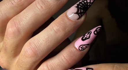 Gothic nail art at Luna-Luxe Beauty Bar, Geelong, Victoria, AU featuring pink polish with black web and mask designs.