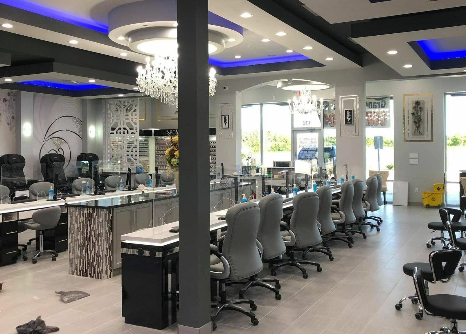 Interior of GrandLux Nails Spa in Round Rock, Texas, US with chic design and comfortable seating.