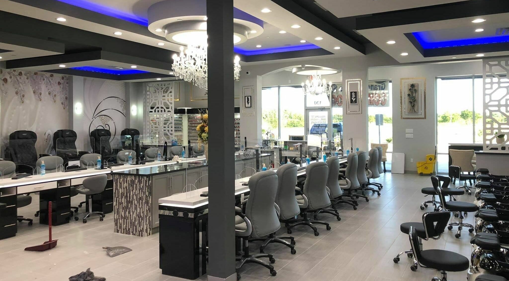 Interior of GrandLux Nails Spa in Round Rock, Texas, US with chic design and comfortable seating.