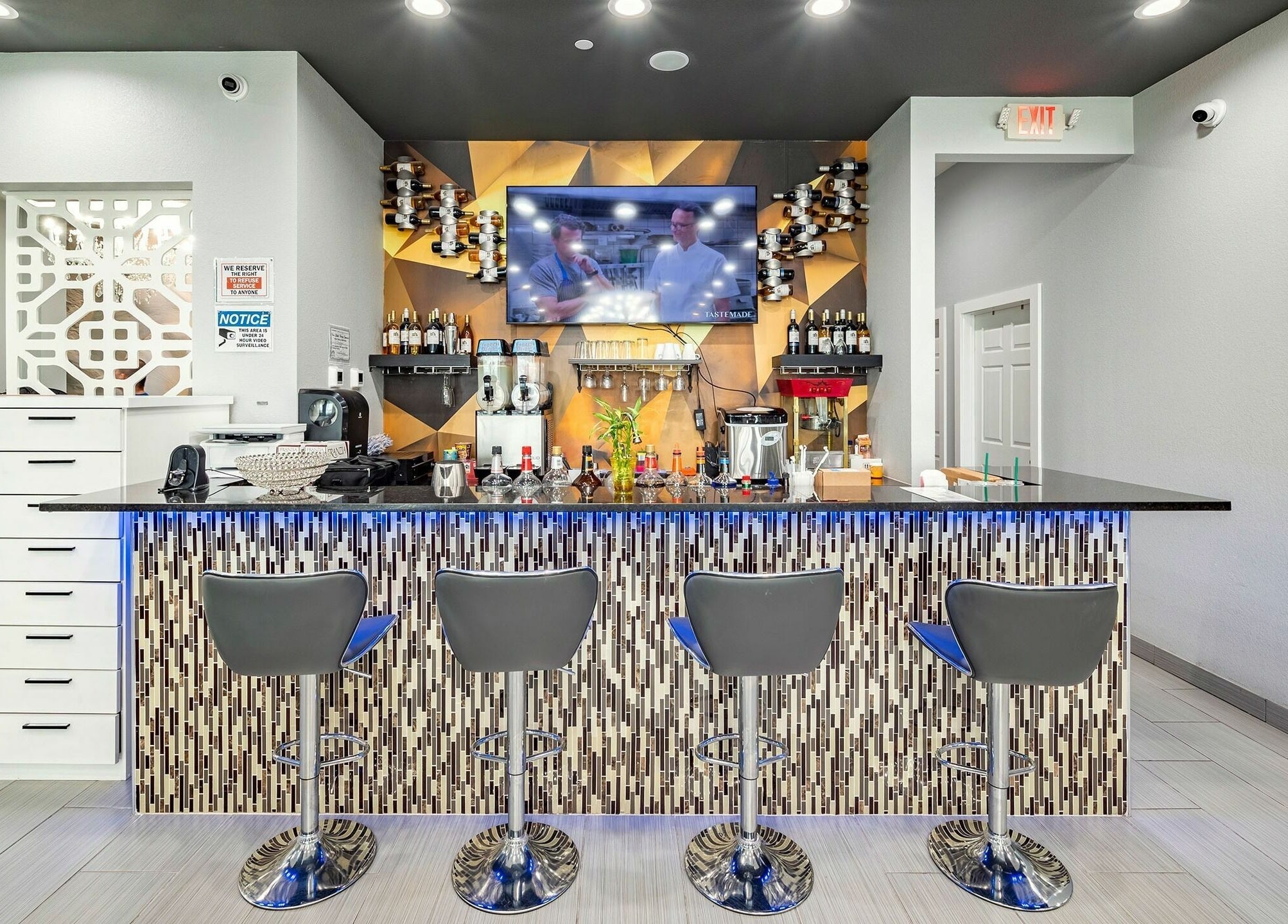 Modern bar area at GrandLux Nails Spa in Round Rock, Texas, US, featuring sleek design and elegant seating.