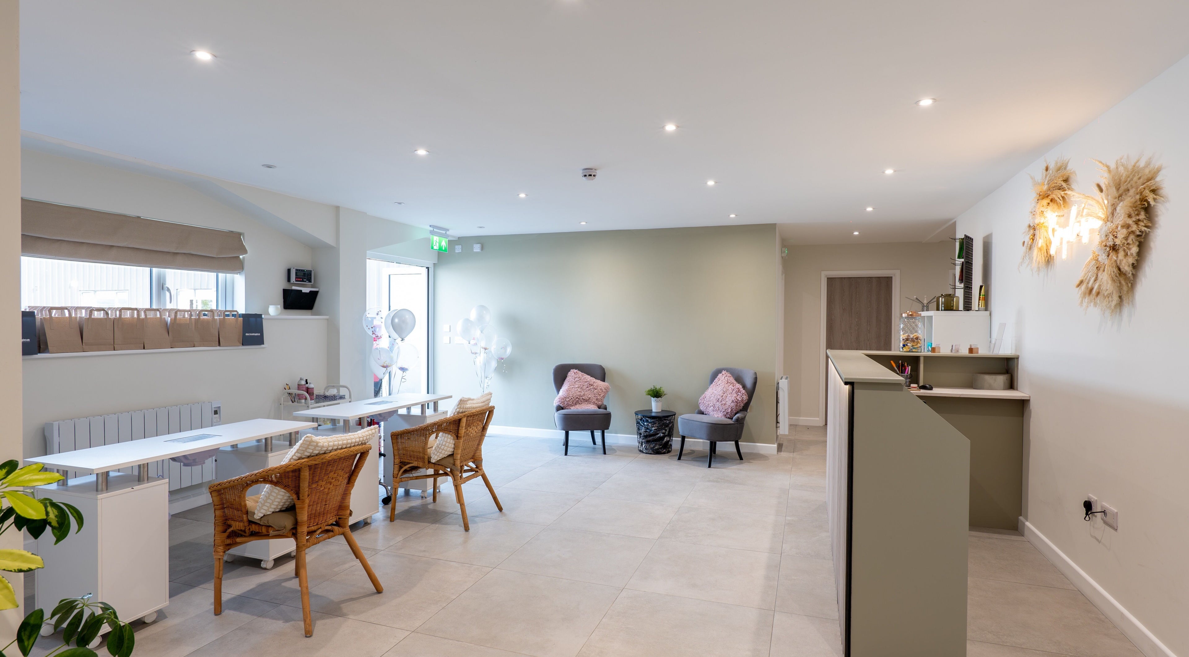 Bright, chic interior of Simple Beauty salon in Cullompton, England, GB with stylish seating and decor.