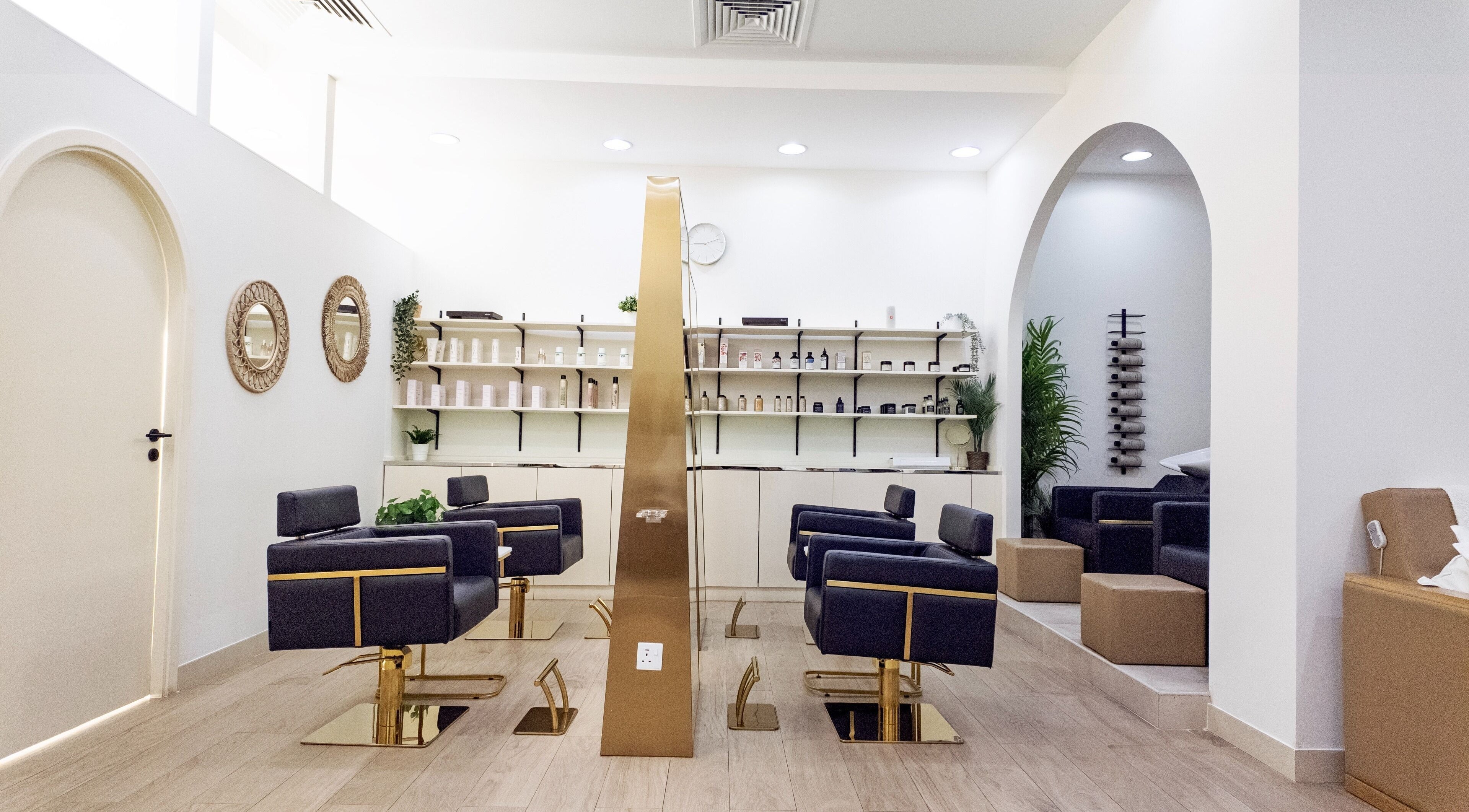 Elegant interior of Soak Salon in Dubai, AE with modern chairs and stylish decor.