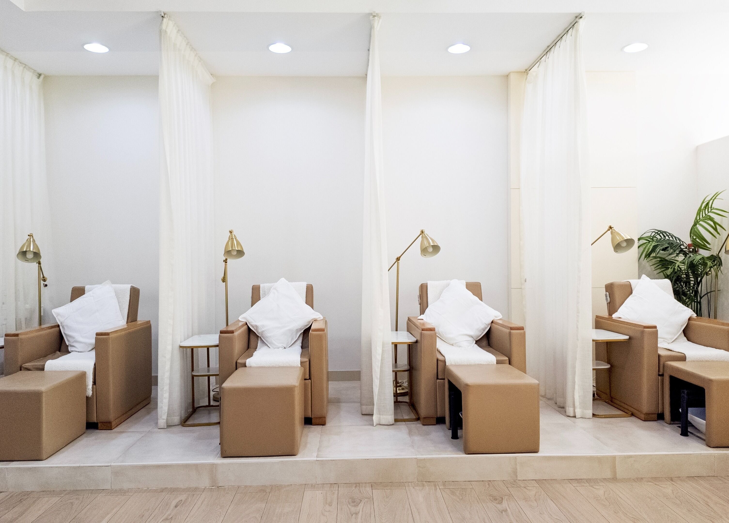 Pampering chairs at Soak Salon, Dubai, AE, providing a luxurious wellness experience with elegant decor.