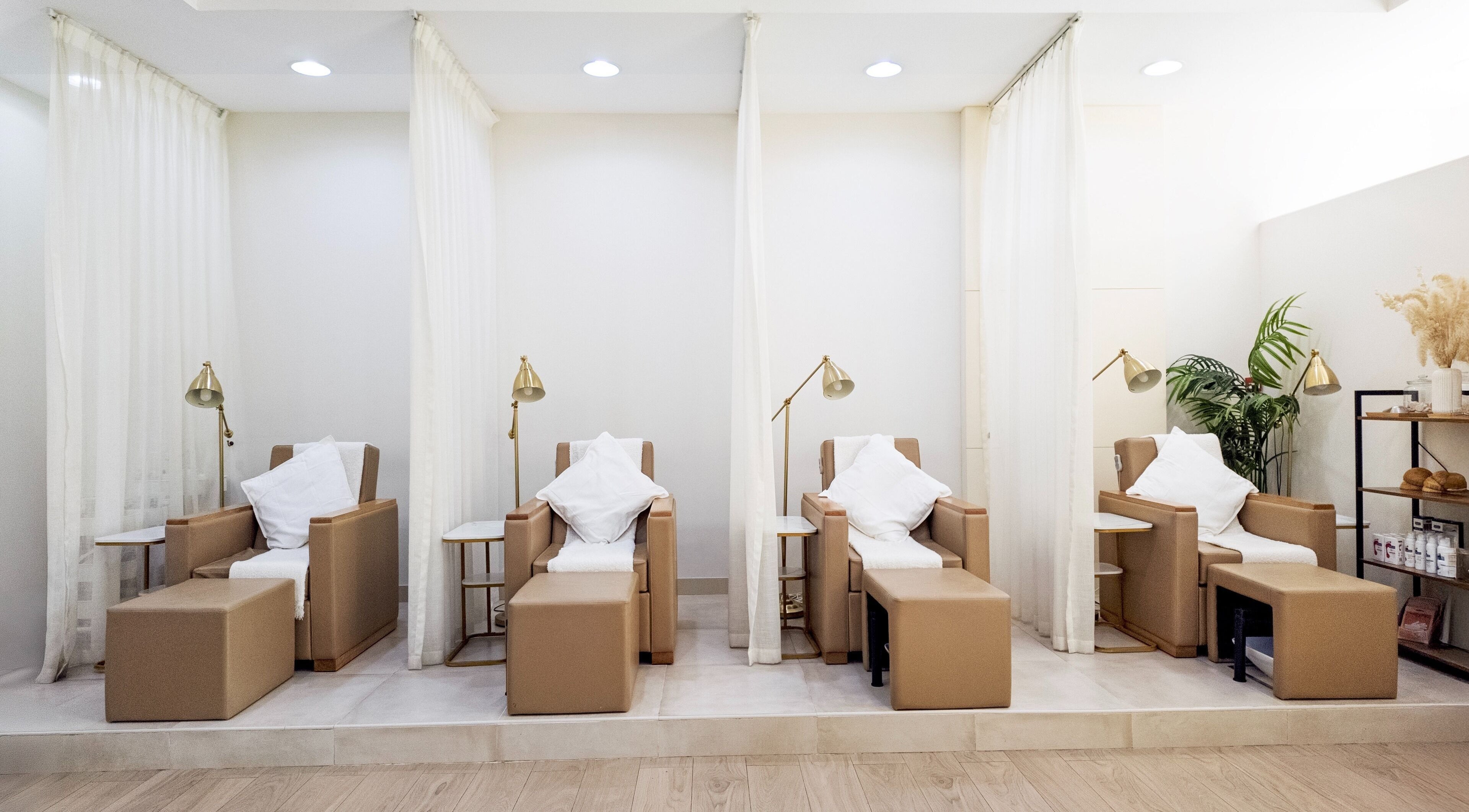 Pampering chairs at Soak Salon, Dubai, AE, providing a luxurious wellness experience with elegant decor.
