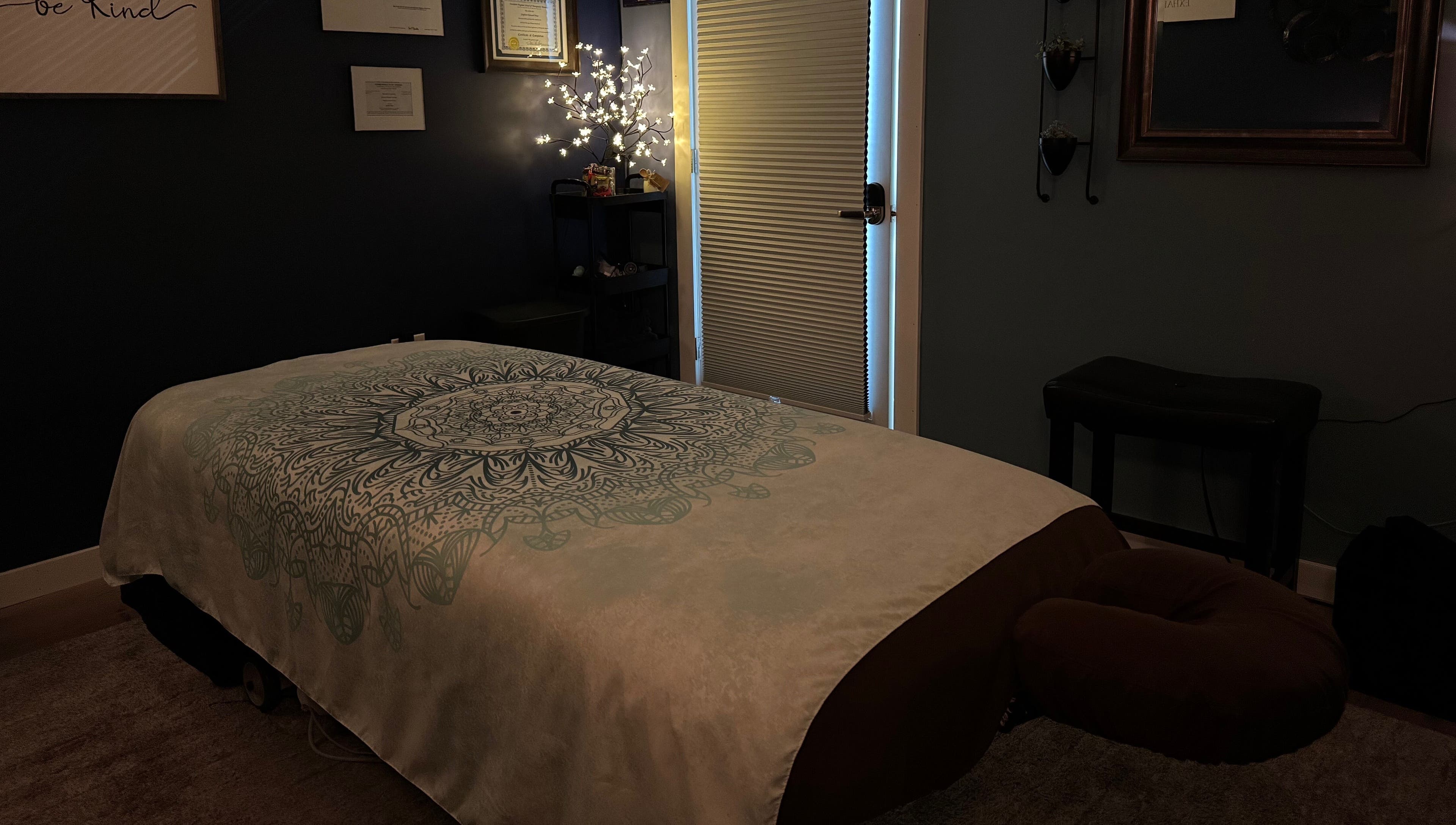Cozy massage room at Serenity Massage in Winchester, Virginia, US, with a decorated massage table.