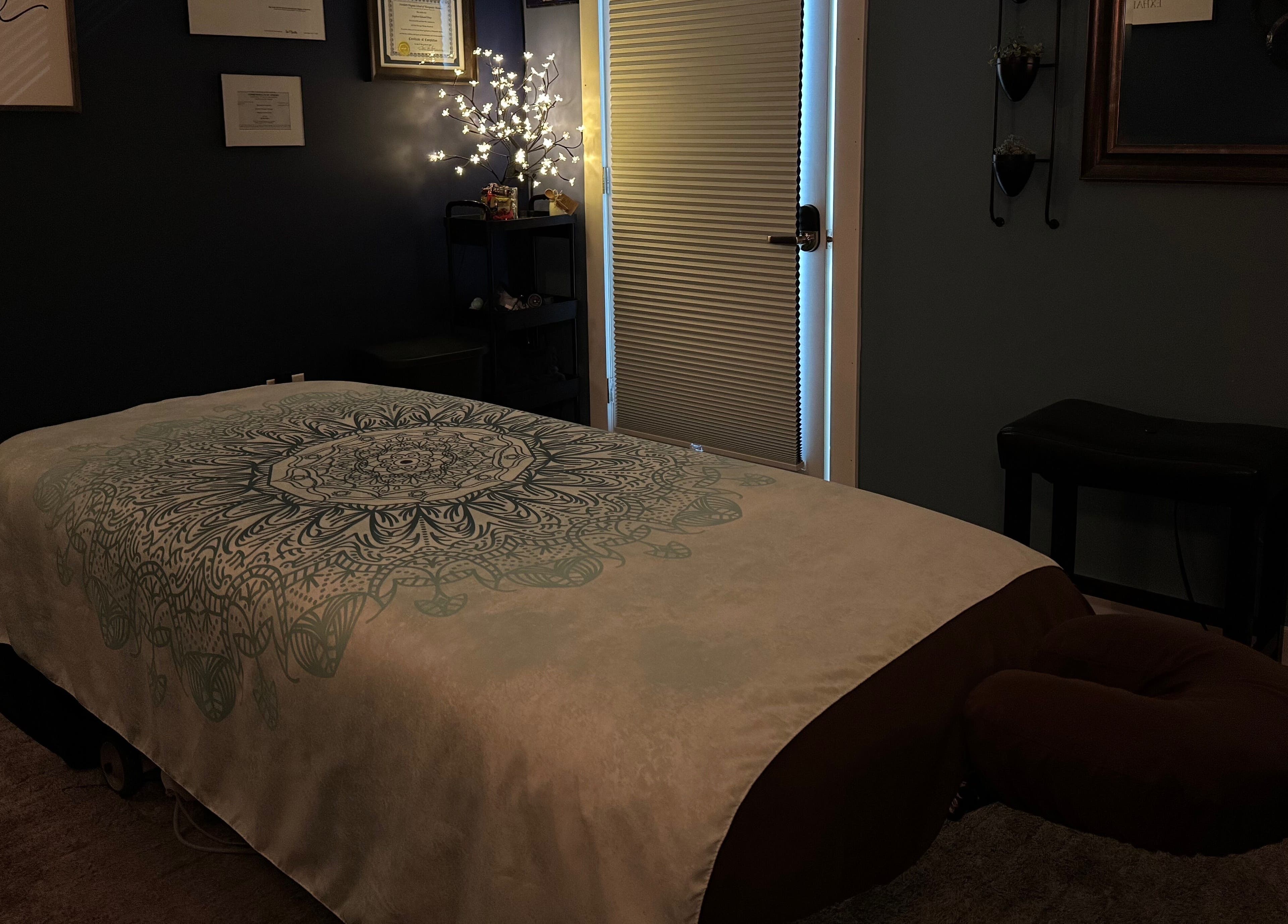 Cozy massage room at Serenity Massage in Winchester, Virginia, US, with a decorated massage table.