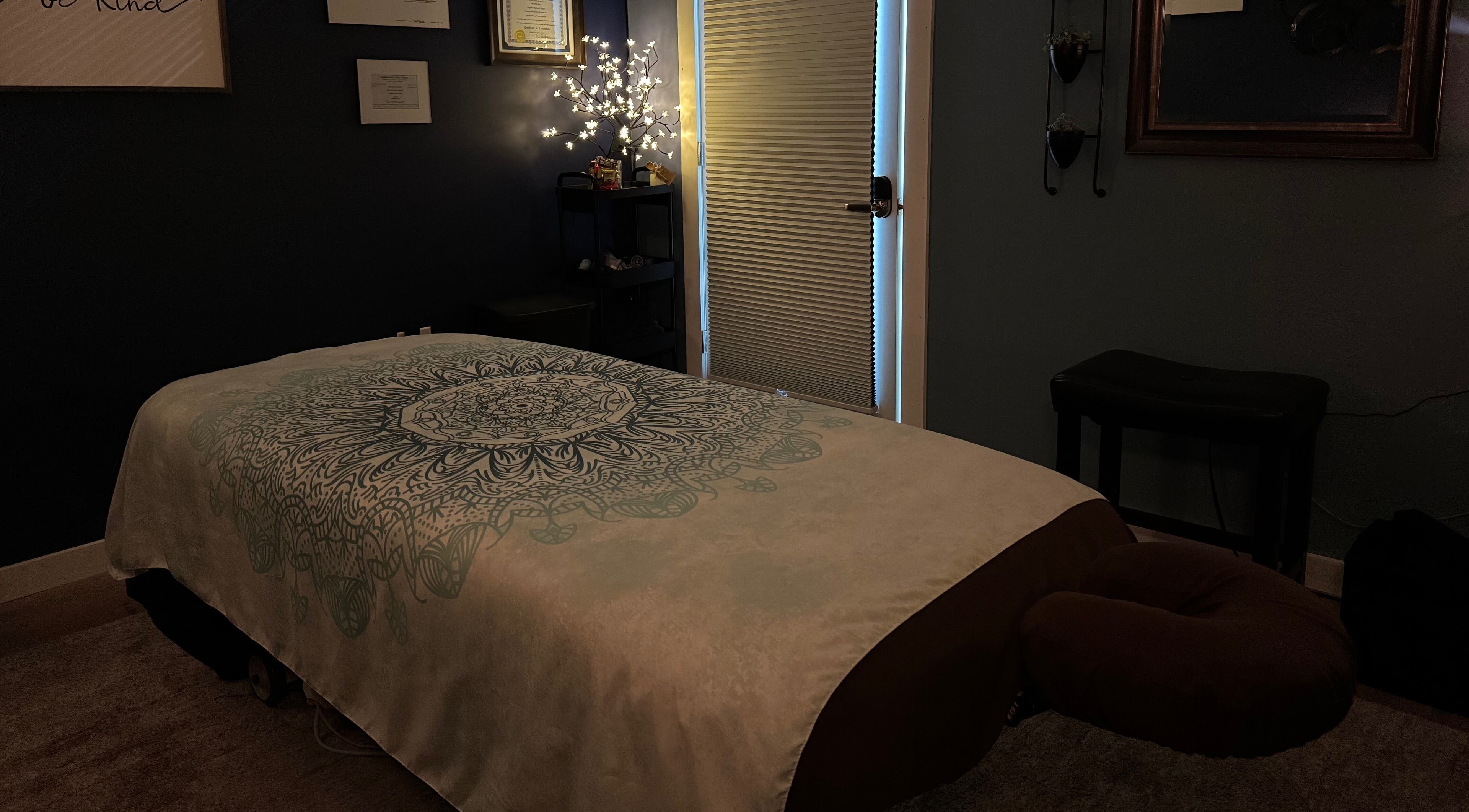 Cozy massage room at Serenity Massage in Winchester, Virginia, US, with a decorated massage table.