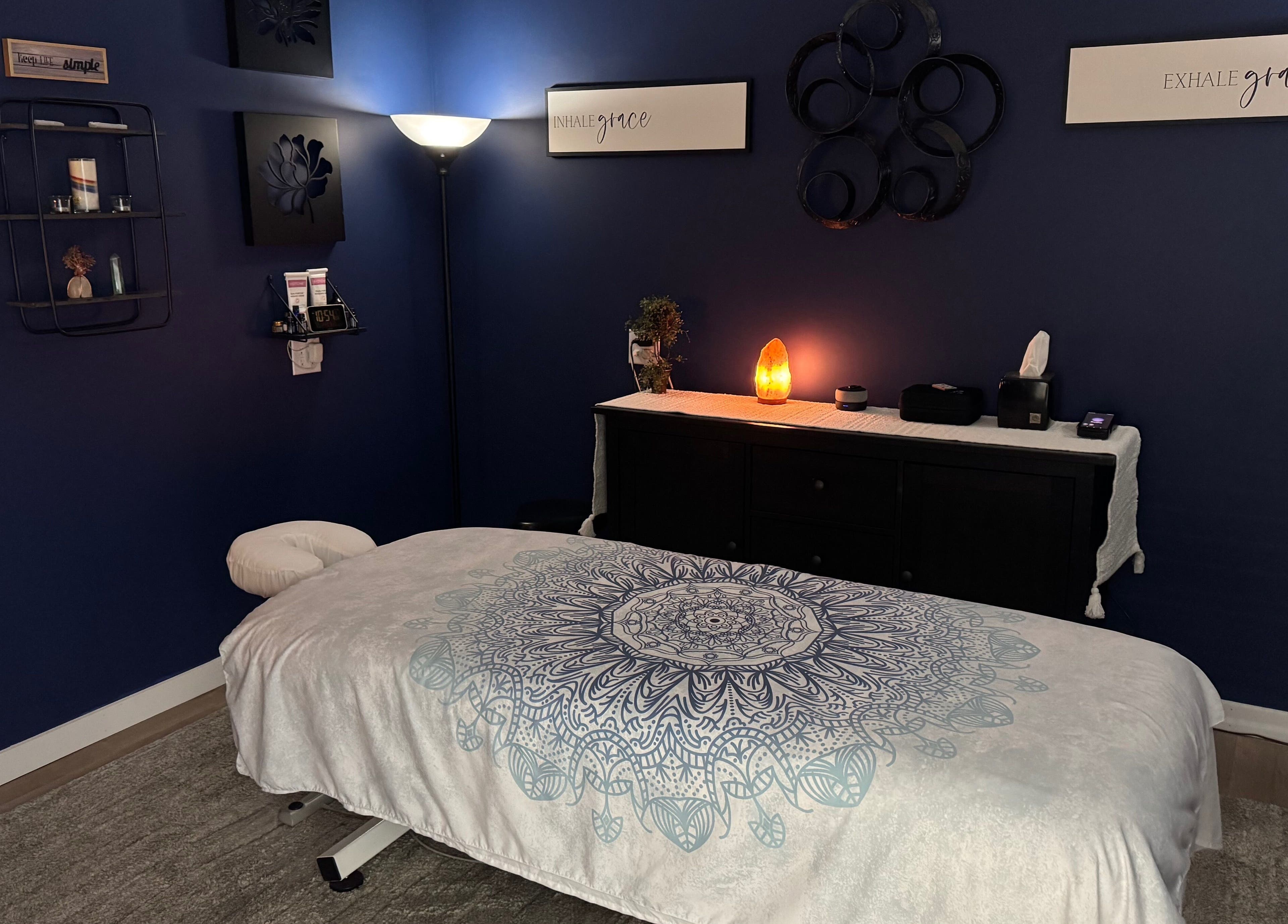 Cozy massage room at Serenity Massage in Winchester, Virginia, US with soft lighting and calming decor.