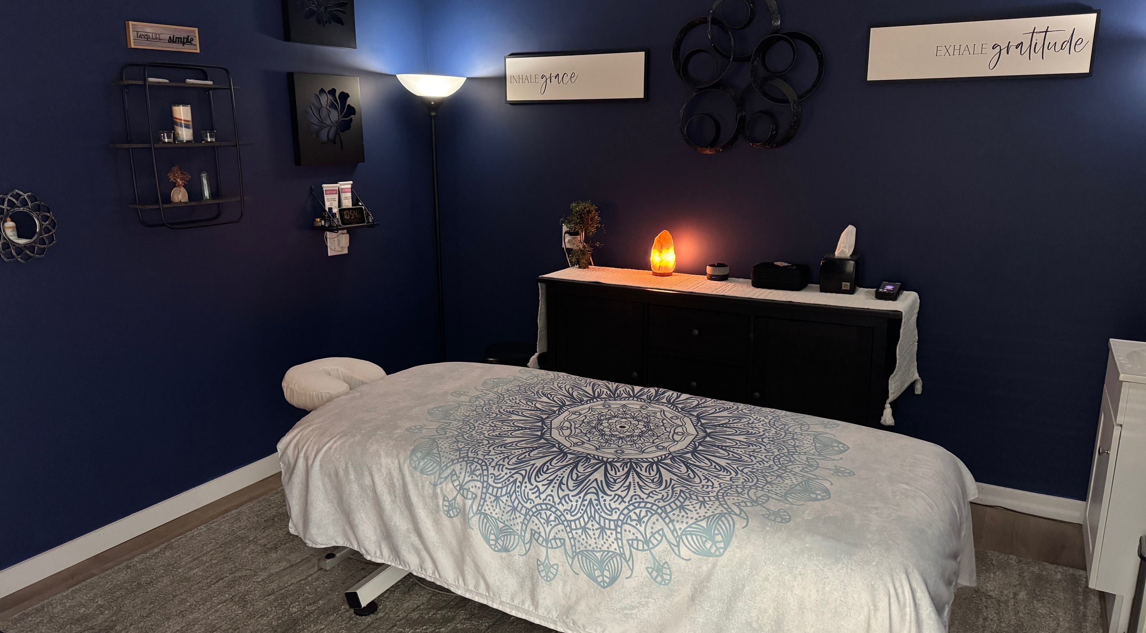 Cozy massage room at Serenity Massage in Winchester, Virginia, US with soft lighting and calming decor.