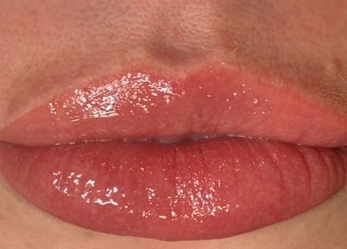 Close-up of glossy lips at Lavish Eyes Studio in Temuka, Canterbury, NZ, showcasing expert beauty care.