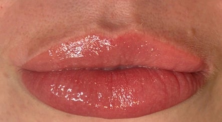 Close-up of glossy lips at Lavish Eyes Studio in Temuka, Canterbury, NZ, showcasing expert beauty care.