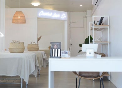 Tranquil interior of Coastal Lash Co. in Maroochydore, Queensland, AU with cozy treatment area and decor.