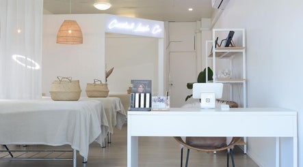 Tranquil interior of Coastal Lash Co. in Maroochydore, Queensland, AU with cozy treatment area and decor.