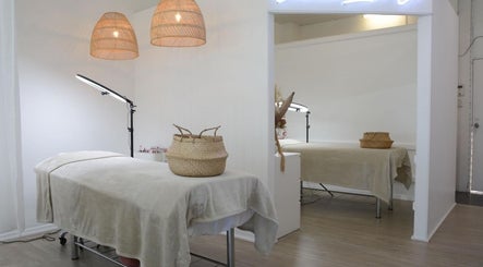 Tranquil spa room at Coastal Lash Co., Maroochydore, Queensland, AU, showcasing cozy treatment beds and stylish decor.