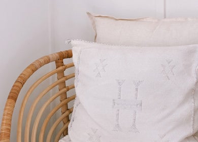Cozy rattan chair with soft pillows at Coastal Lash Co., Maroochydore, Queensland, AU.