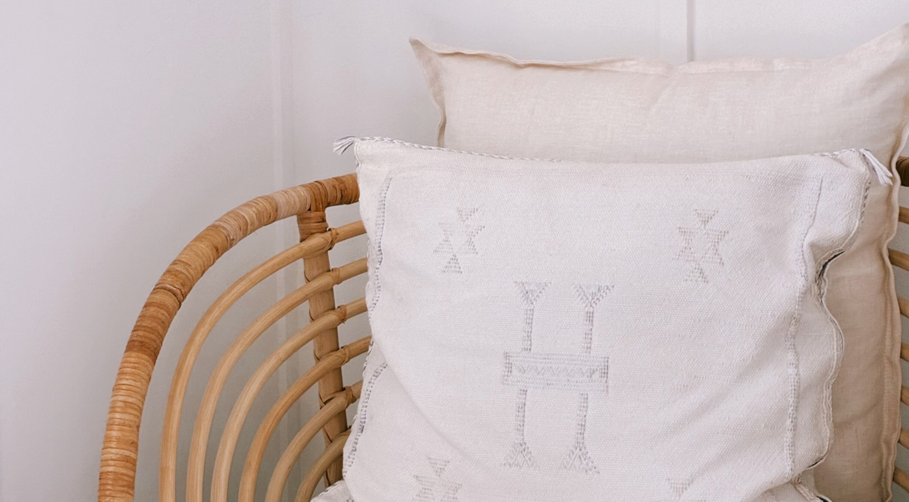 Cozy woven chair with cushions, Coastal Lash Co. in Maroochydore, Queensland, AU offers comfort and style.