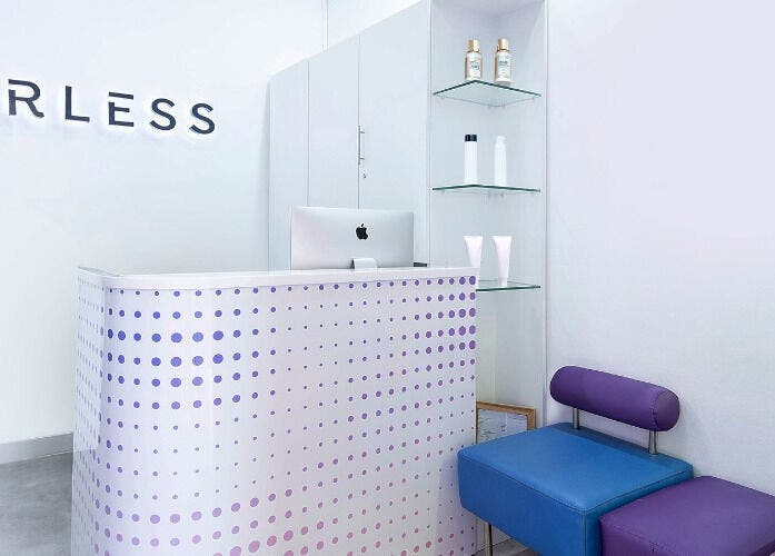 Modern reception area of Furless Permanent Muroor Road in Abu Dhabi, AE, featuring sleek design and comfortable seating.